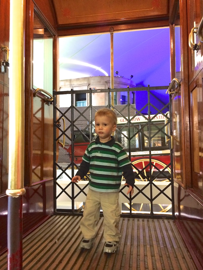 Liam on an old timey double decker bus